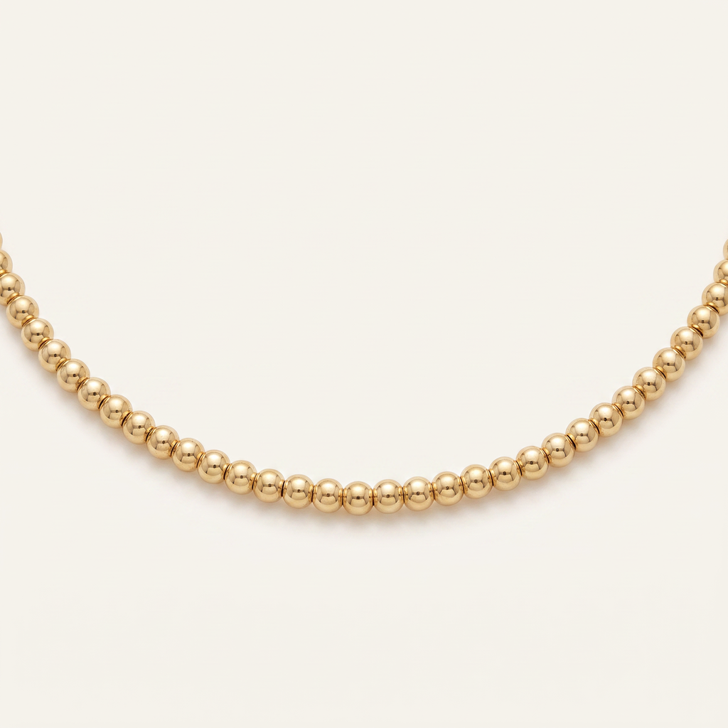 Collier ras de cou à boules 4 mm, détail du motif, doré