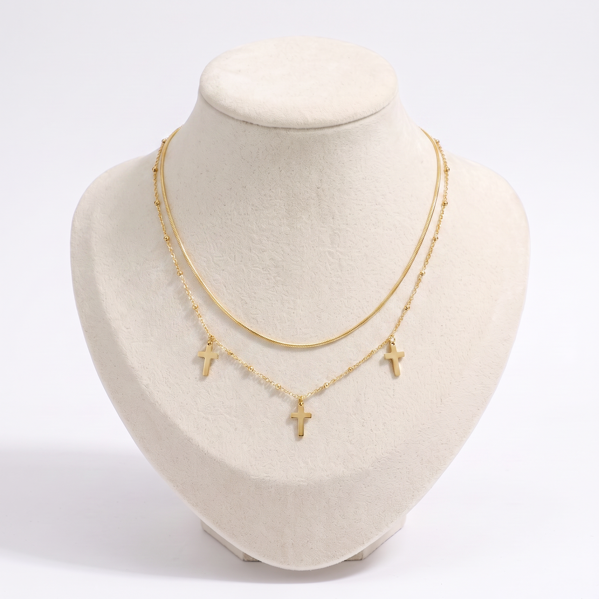 Collier croix double rang, vue de face, doré