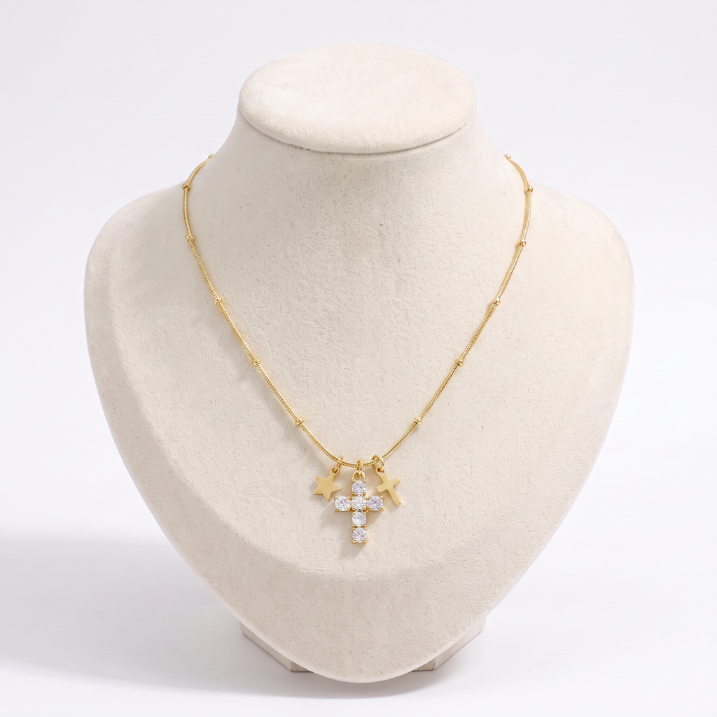 Collier croix et étoile à strass, vue de face, doré
