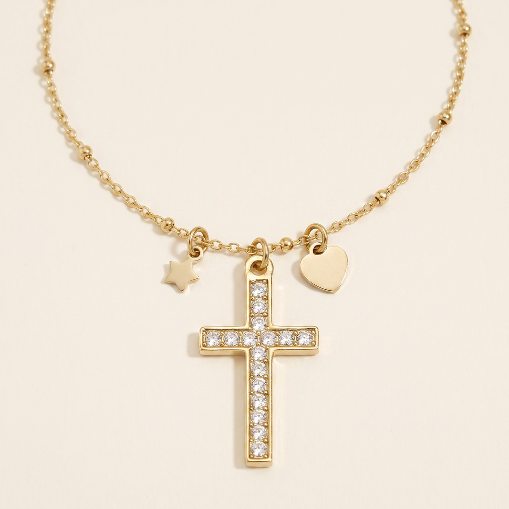 Collier croix, cœur et étoile à strass, détail du motif, doré