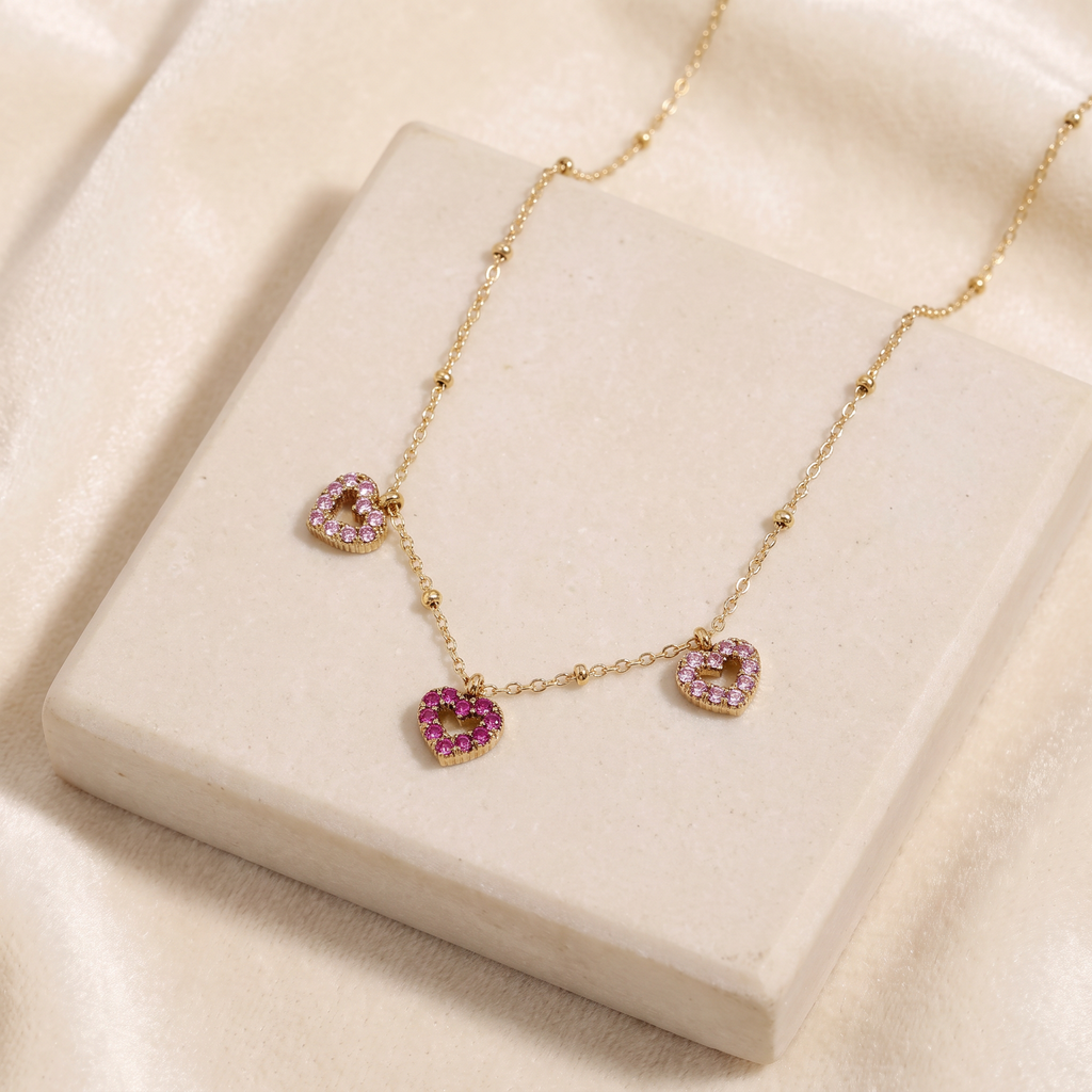 Collier cœur à strass rose — Doré