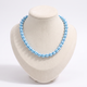 Collier de perles rayé en couleurs, vue de face, bleu