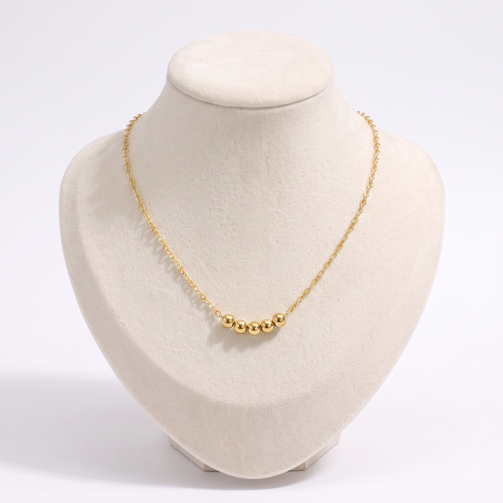 Collier ras de cou à boules, vue de face, doré