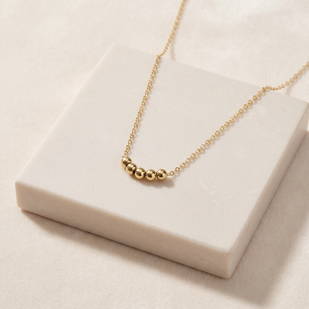 Collier ras de cou à boules — Doré
