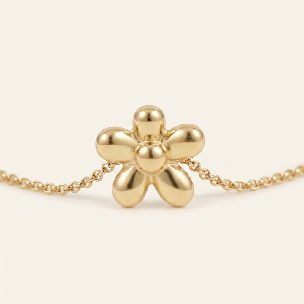 Collier fleur à motif bombé, détail du motif, doré