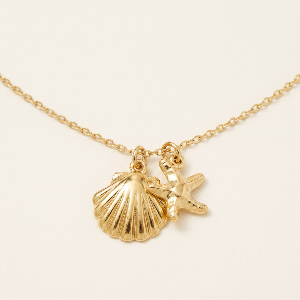 Collier étoile de mer et coquillage, détail du motif, doré