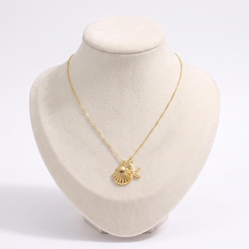 Collier étoile de mer et coquillage, vue de face, doré