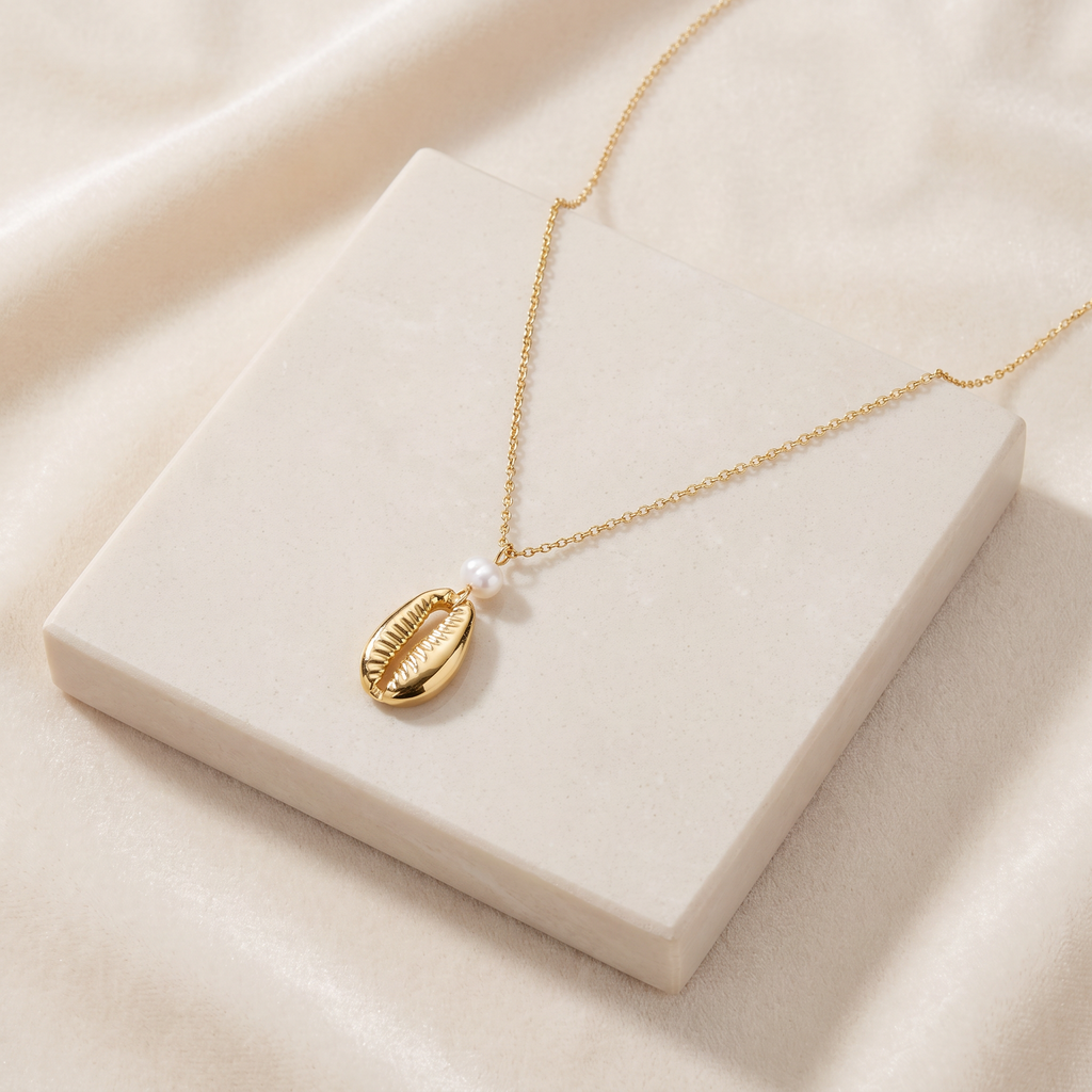 Collier cauri en perles — Doré