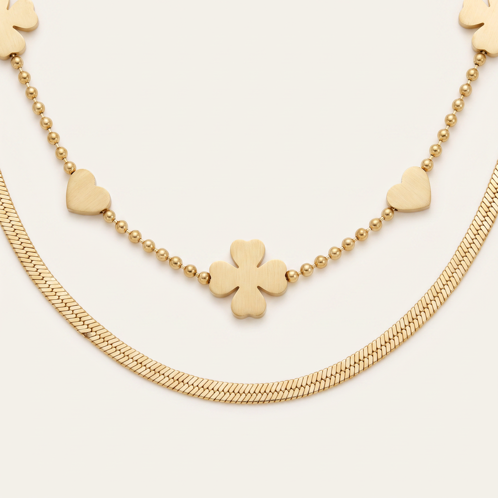 Collier cœur et trèfle double rang, détail du motif, doré