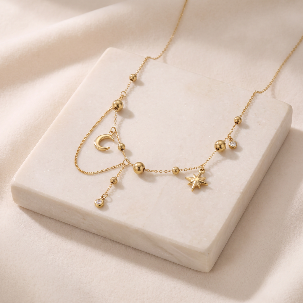 Collier étoile et lune à strass — Doré