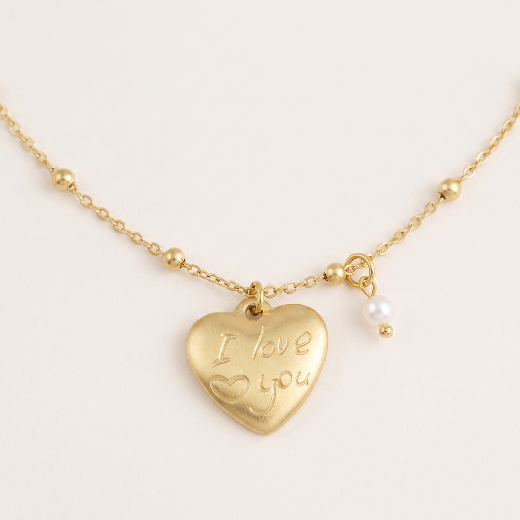 Collier cœur, détail du motif, doré