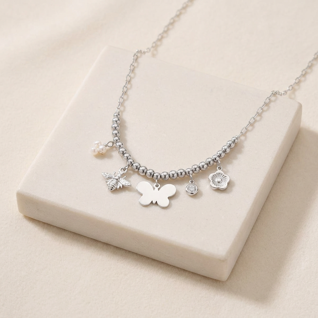 Collier charms fleur et papillon — Argenté